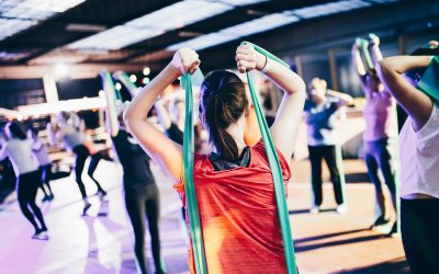 Image of a group of people exercising with resistance rubber bands.