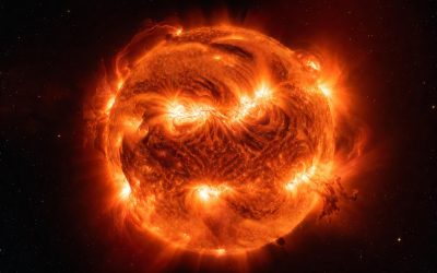 Dramatic full view of the Sun in vibrant fiery orange with turbulent plasma surface and powerful solar flares — the ultimate natural fusion reactor.