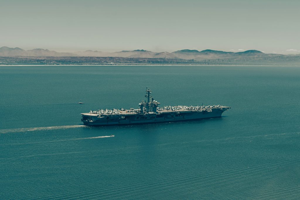 Large warship sailing on the open sea.