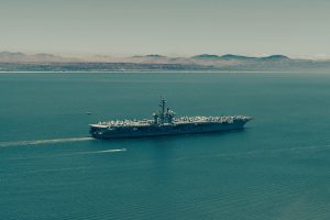 Large warship sailing on the open sea.