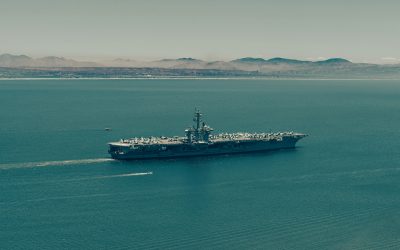 Large warship sailing on the open sea.