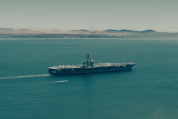 Large warship sailing on the open sea.