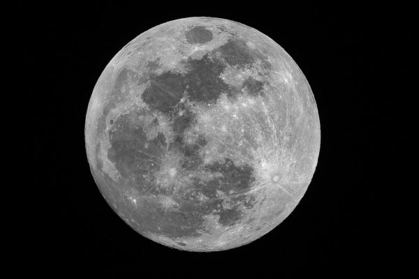 High-resolution view of the full Moon with visible surface features including dark maria and bright crater rays.