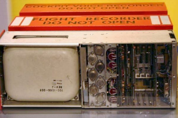 Open orange flight recorder showing the memory unit and circuit boards.
