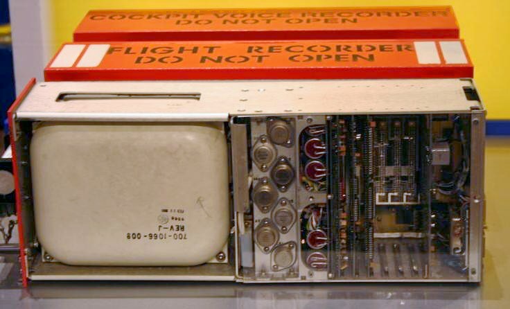 Open orange flight recorder showing the memory unit and circuit boards.