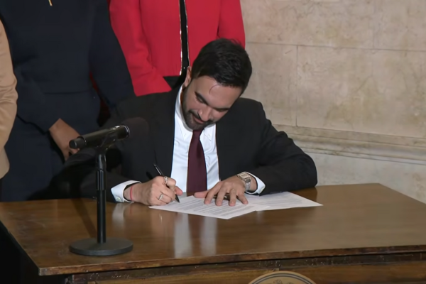 Mayor Zohran Mamdani signs an order. Credit: NYC Mayor’s Office, CC BY 4.0.