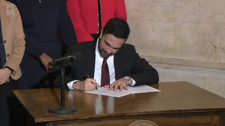 Mayor Zohran Mamdani signs an order. Credit: NYC Mayor’s Office, CC BY 4.0.
