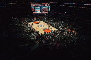 Overhead view of a Clippers basketball game at Staples Center, with the jumbotron reading “CLIPPERS WIN.”