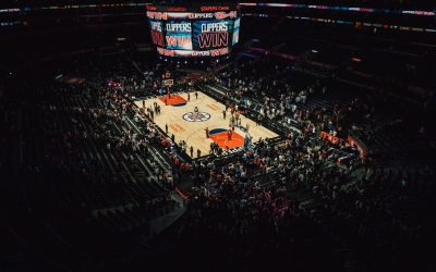 Overhead view of a Clippers basketball game at Staples Center, with the jumbotron reading “CLIPPERS WIN.”