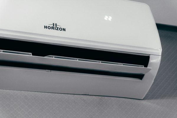 White Horizon wall-mounted mini-split indoor unit with the display set to 22 and the front vent open.